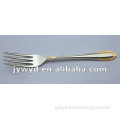 stainless steel dinner fork with golden on handle